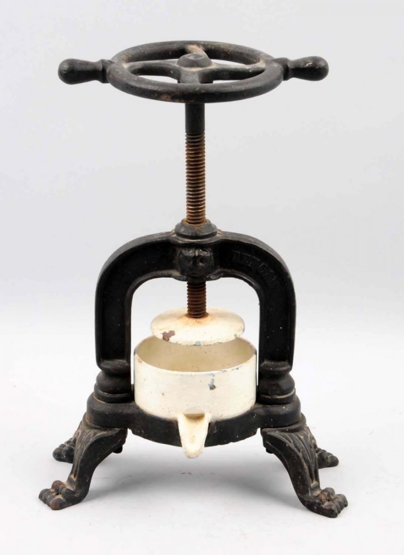 1880s – 90s Cast Iron & Porcelain Fruit Juicer.: Probably French made with a hand crank corkscrew mechanism. Porcelain cup has been repainted only light to moderate overall wear. Condition (Very Good - Excellent). Size 13 - 1/2" T.