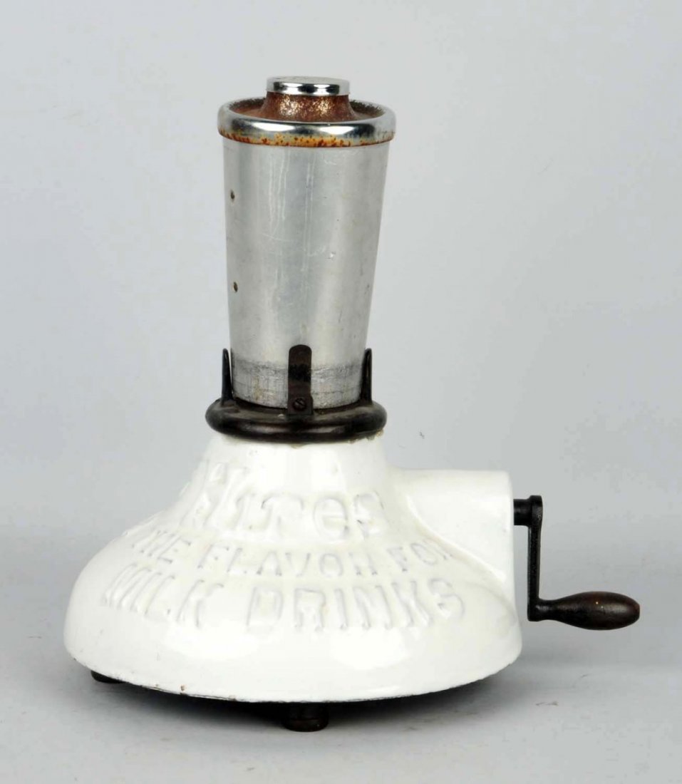 Early & Scarce Hires Milk Shake Mixer.: Hand cranked mechanism on this heavily made porcelain and iron piece. Includes its old cup with integrated mixer and lid. Light wear overall with rust on lid. Condition (Excellent). Size 13" T.