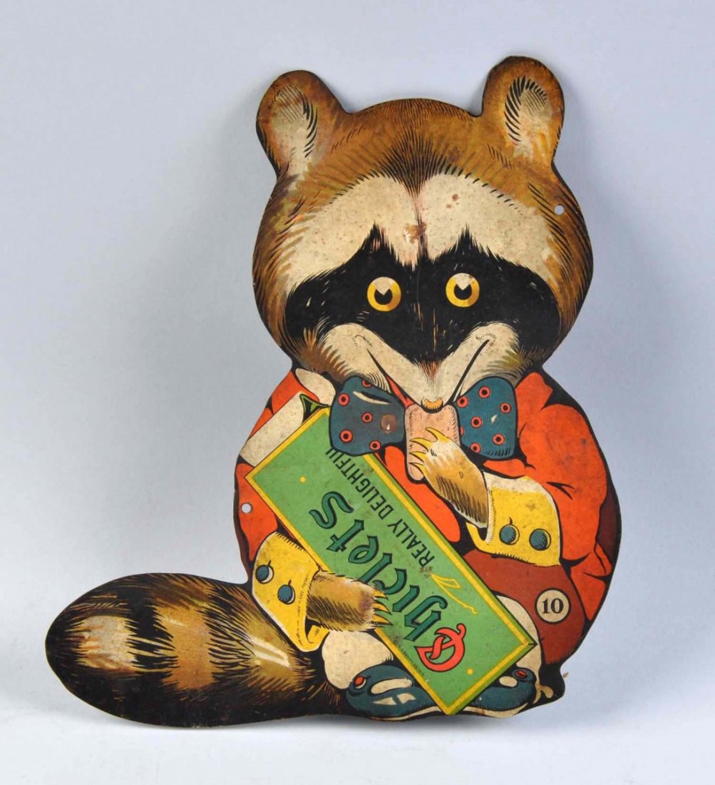 Scarce Chiclets Gum Die Cut Raccoon Figure.: Tin litho piece with its original metal easel. Medium soiling and some light stains, with a few very small rust spots and a minor bend or two. Lots of color and displays well. Dated 1916. Condition (V