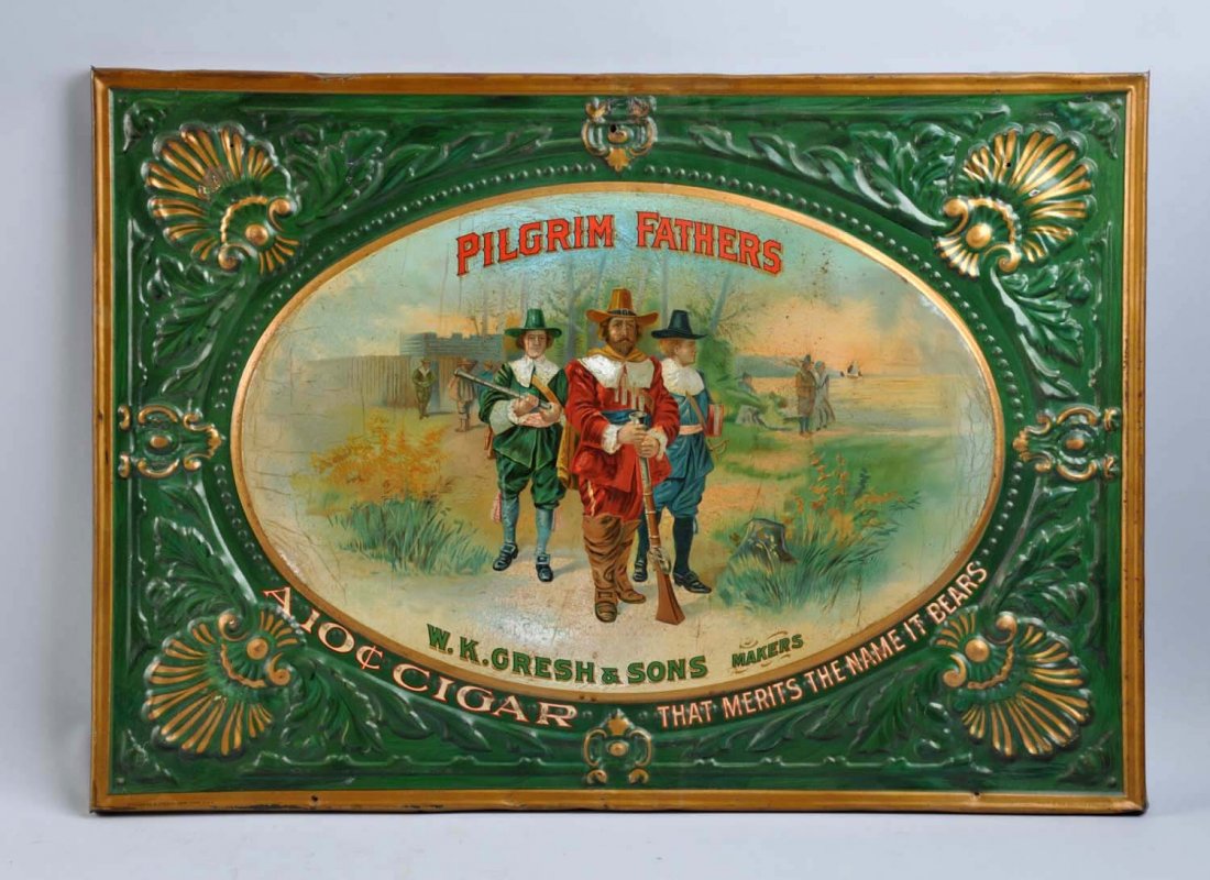 Circa 1905 Pilgrim Fathers Embossed Cigar Sign.: This tin sign is very heavily embossed and still mounted over its original wooden plaque. Five small nail holes are in the sign with some mild rubs and color nicks on the surface. A few shallow dents 