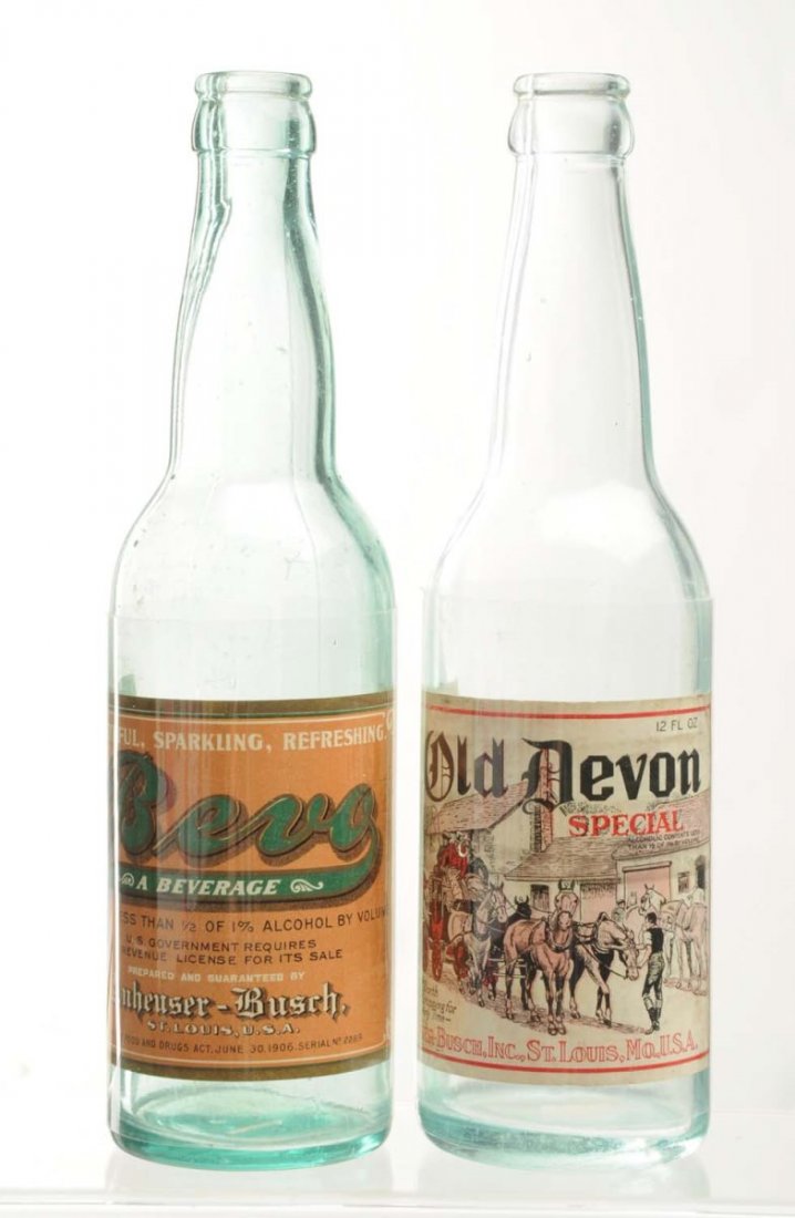 Lot Of 2: Anheuser-Busch Beer Bottles.: Pre-Prohibition. This lot includes a bottle with a Bevo Beverage label and a bottle with an Old Devon Special label. These are both low alcohol beverages. The Old Devon label has moderate wear and dam