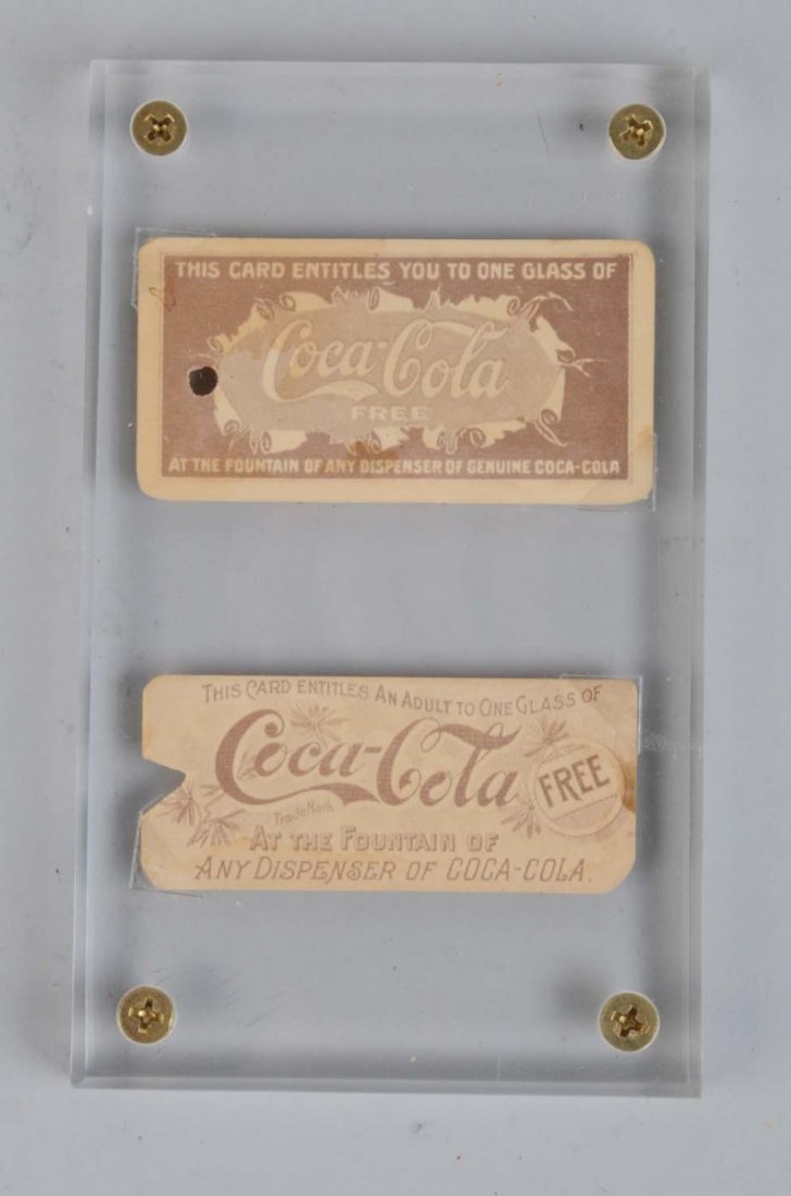 Lot of 2: Early Coca-Cola Coupons.: One coupon has a punch hole and the other has a notch cut. Both have a few small stains. Condition (Good). Size 6" x 4".