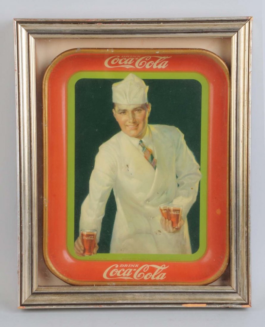 1928 Coca-Cola Serving Tray.: This tray has minor rim chipping and a few chips to the image. A small faded spot to red border at right. Condition (Very Good). Size 16" x 13".