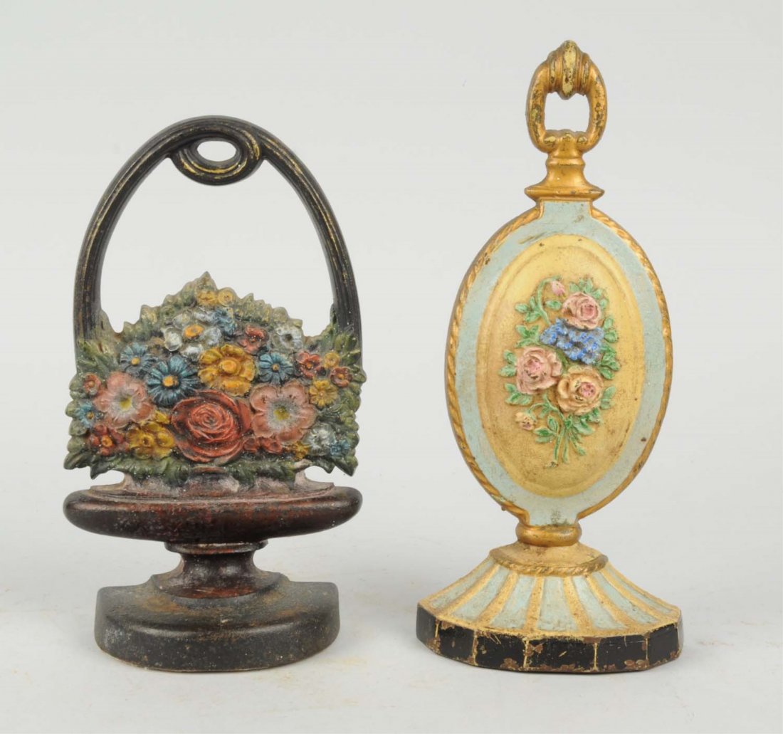 Lot Of 2: Cast Iron Assorted Flower Doorstops: Includes – Flower Medallion, Hubley; mixed flowers in basket, “B&H”. Condition (Very Good). Size Largest : 10 - 1/8" T.