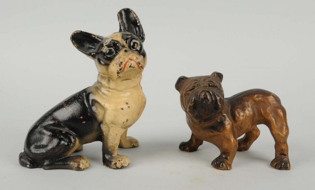 Lot Of 2: Cast Iron Assorted Dog Doorstops.: Includes: sitting French Bulldog; English Bulldog. Each Hubley. Condition (Very Good). Size Largest: 7 - 1/2" T.