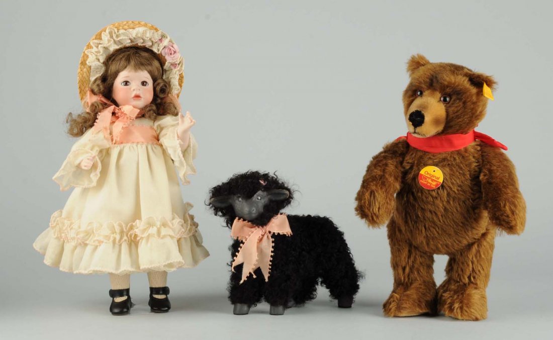 Lot of 3: Doll And Two Stuffed Animals.: Lot includes a doll, artist "Wendy Lawton" doll, a baa baa black sheep, and a Steiff brown bear with button and tags. Condition (Very Good). Size Tallest: 13".