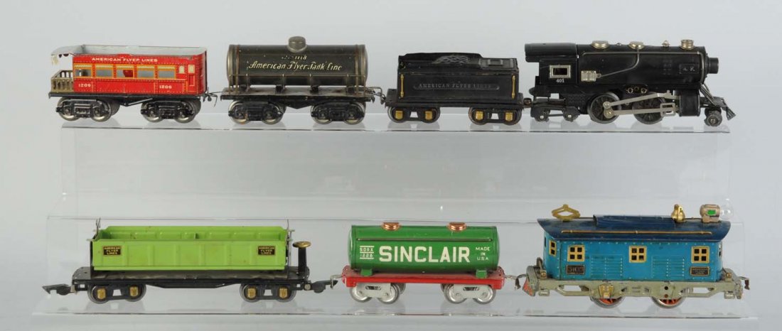 Lot of 2: Assorted Train Lot.: Includes a lot of 11 American Flyer O-Gauge trains. Lot consists of 4012-4-4 Steam locomotive needs to have front and rear truck wheels replaced. Motor is free. Has a few scratches and paint chips. 31