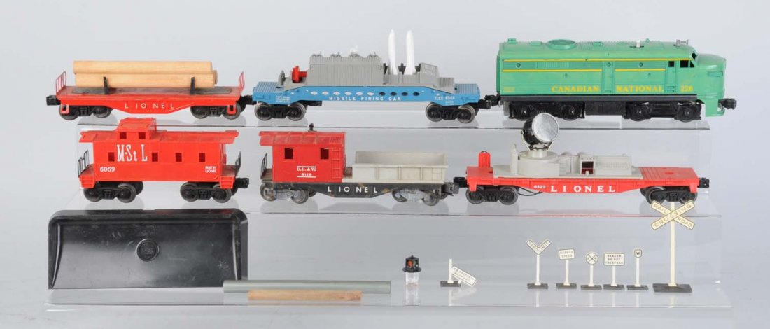 Lionel 228 Canadian Nation Alco & Freights.: 228 Canadian National Alco, while this locomotive is uncommon it should be noted that it has the usual problem which is a cracked coupler support bar, otherwise complete and all original, very good co