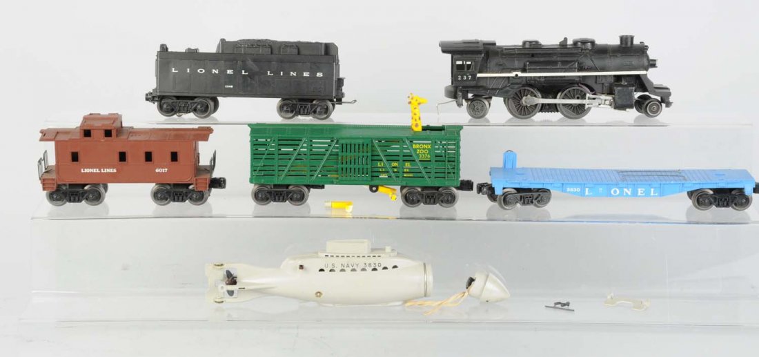 Lionel 237 L&T Plus 3376 Green Bronx Zoo Car.: Includes: 237 Steam locomotive with smoke, clean and original, excellent condition. 234W whistle tender, has one broken step otherwise all original and in good condition. 3376 Green Bronx zoo car, act