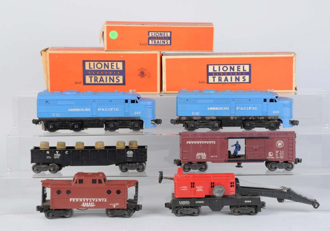 Lionel 205 Missouri Pacific Alco's & Freights.: Includes: Lionel 205 Missouri Pacific powered alco, dirty, has some scratches, rust on the frame, good condition. Dummy locomotive, rusty frame, dirty and scratched, good condition. 6560 crane car, br