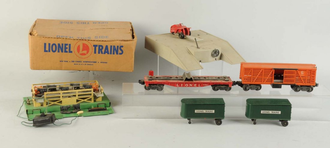 Lionel 460 Piggy Back Set & Cattle Set.: Lot includes 3656 operated cattle car, dirty needs cleaning but not rusty, some bent steps. Seven original cattle. 3656 operating cattle corral, dirty and needs cleaning, has paint chips but very good