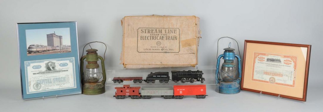 Lot of Assorted Train Items.: Includes two framed train certificates and posters, two lanterns, a Marx 4975 boxed set, a Marx 999 freight set and other miscellaneous trains, boxes and other items. Condition (Good - Excellent).