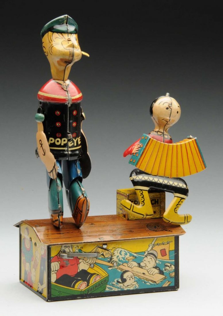 Tin Litho Wind-Up Popeye Roof Dancing Toy.: Depicts Popeye dancing, and Olive Oyl playing the accordion. Popeye has his original arms and pipe. Looks to be original coil wire bun on the back of Olive Oyls head. Some scratching and litho loss on