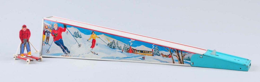 Tin Ski Sloop.: Reproduction skier on cart with wheels rolling down an angled tin platform, at bottom he gets catapulted through a mechanical mechanism. The toy has small areas of litho scratches throughout toy. Beau