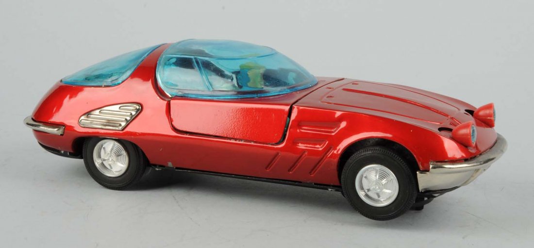 Jap. Tin Battery - Operated Bertone Concept Car.: Made by Bandai. Plastic bubble intact. Some scratching, but no cracking. Some general wear. Condition (Very Good). Size 12 - 1/2" L.