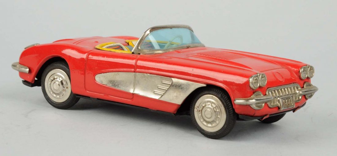 Japanese Tin Litho Friction Toy Corvette.: Made by Yonesowa, 1960 model. Some oxidation to bare metal parts. Condition (Very Good - Excellent). Size 7 - 3/4" L.