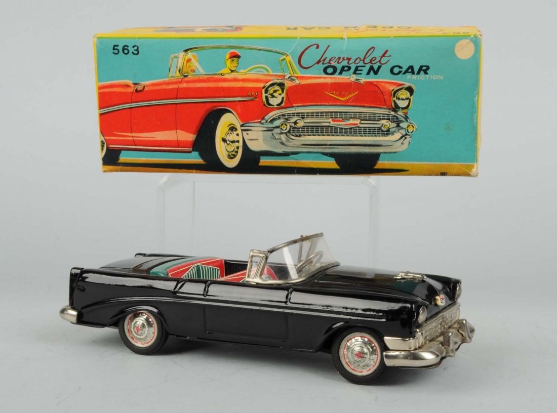 Japanese Tin Litho Friction Chevrolet Convertible: Includes original box with nice colorful graphics, does have some tearing and creasing. Car is made by Bandai, does have some scratching and wear on bottom of car and some twisting, pitting and oxidat