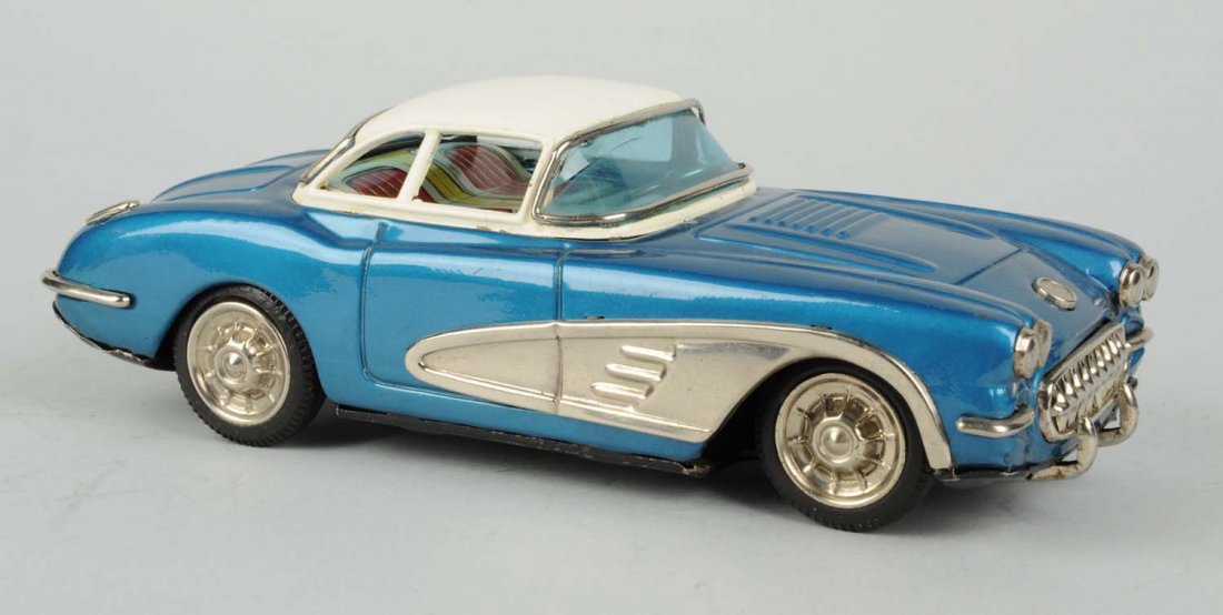Japanese Tin Litho Friction Toy Corvette.: Made by Yonezawa. Nice two tones blue with white roof, some paint tough up to roof. Some oxidation to bare metal parts. Condition (Very Good). Size 9 - 1/2" L.