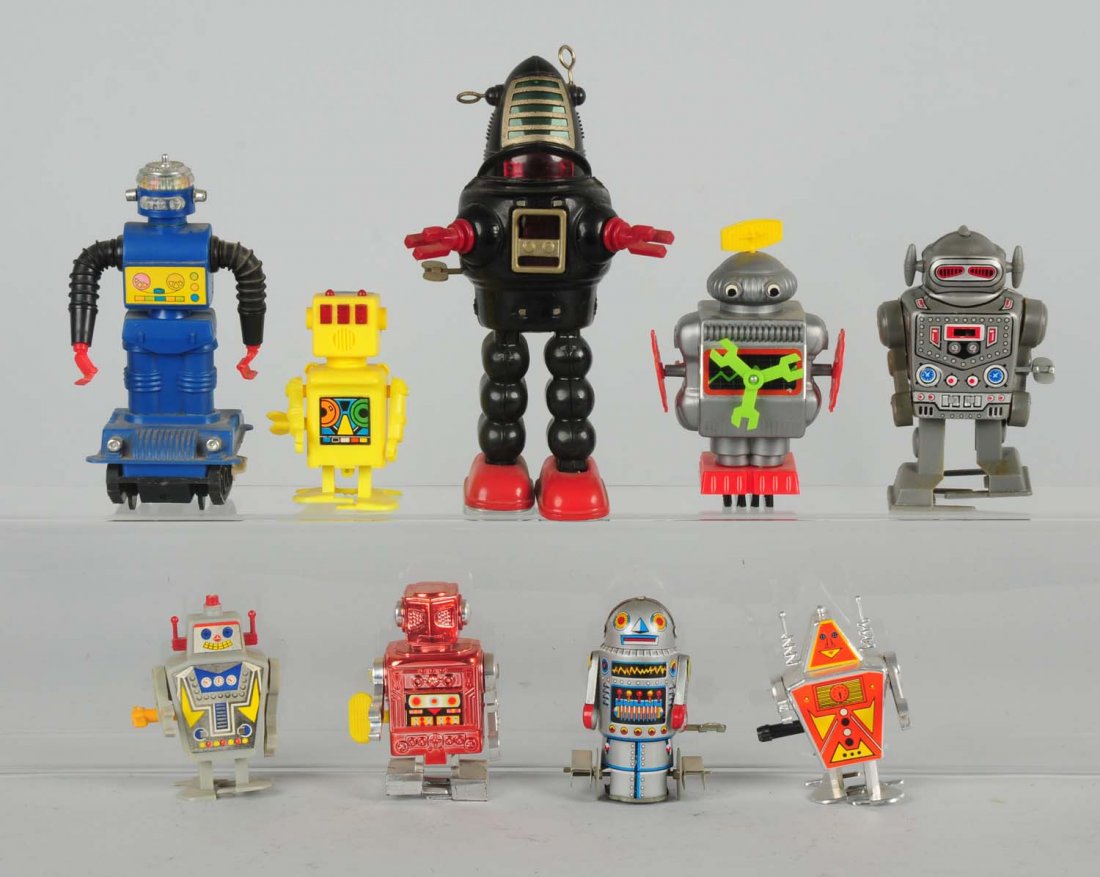 Lot of 9: Plastic & Tin Robot Toys.: Some older and some contemporary robots. Condition (Good - Excellent). Size Largest: 9" T.