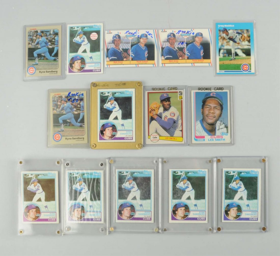 Lot Of 14: Chicago Cubs Player Baseball Cards.: Includes nine Ryan Sandberg rookie cards (seven Topps and two Fleer), Greg Maddux rookie cards, Mark Grace rookie cards, and Lee Smith rookie cards. Condition (Very Good - Excellent).