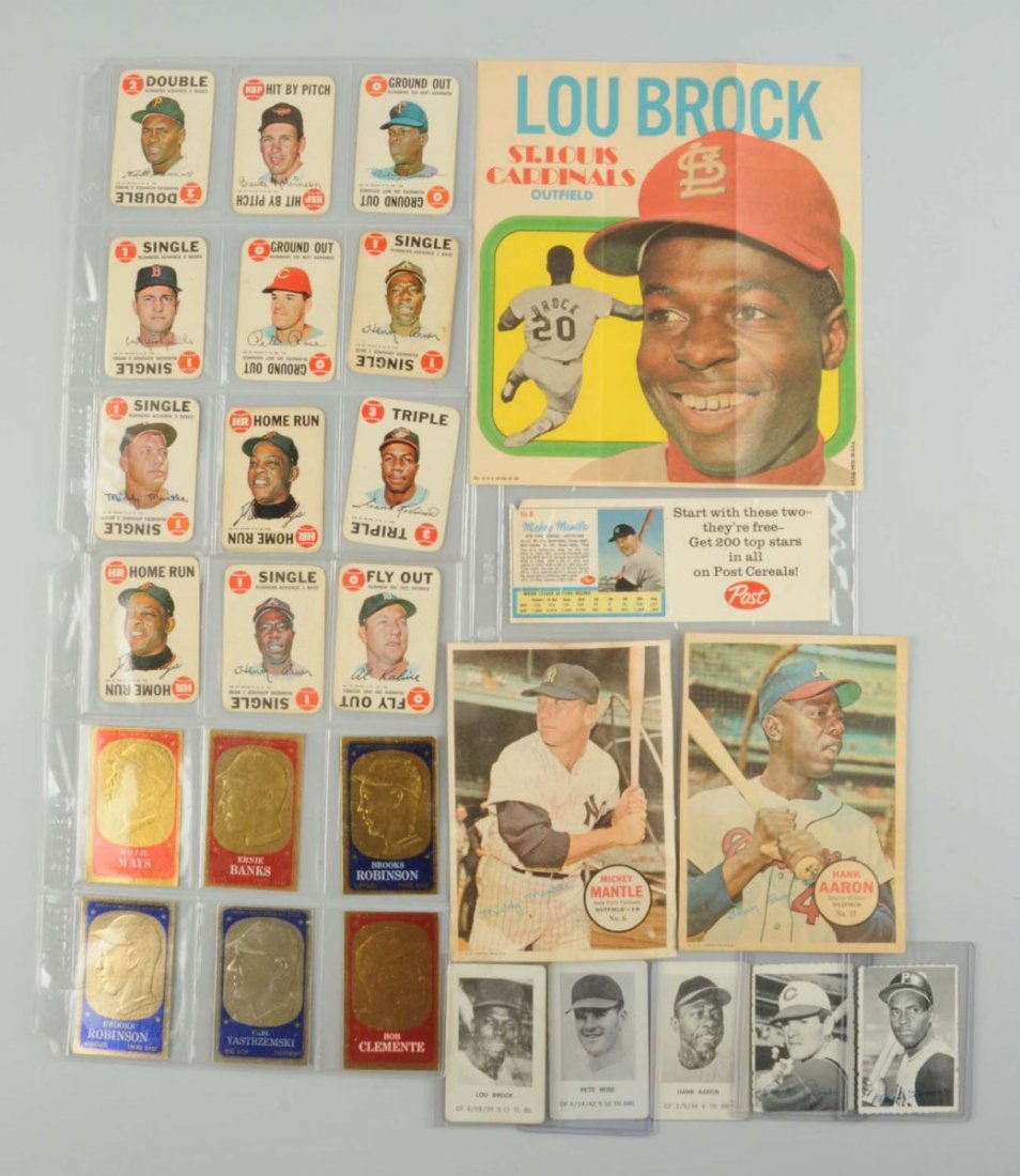 Lot Of 1960's Baseball Cards & Memorabilia.: Lot consists of three posters; including a Lou Brock, Mickey Mantle, and Hank Aaron. There is a Post cereal Mickey Mantle card with ad, and has Roger Maris on the back. Several Deckle insert cards, a 