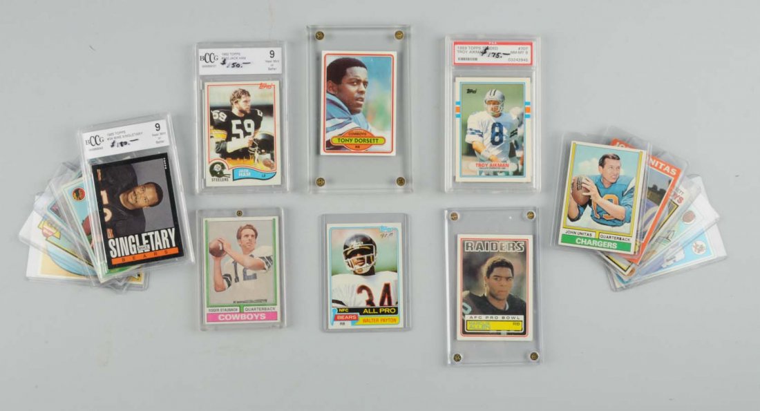 Lot Of 17: 1970's-80's Football Player Cards.: A few are graded, two by PSA. Two have Beckett Grading header cards. Many Hall of Famers including Roger Staubach, Bart Starr, and others. Cards of Walter Payton, Alex Karris, Tony Dorsett. Condition 