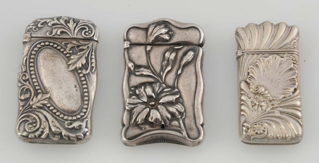 Lot Of 3: Sterling Silver Match Safes Or Vestas.: The first is a floral by Smith Co., the second has a seashell by Towel, and the third is a floral by Le Bolt. All have strong hinges and no damage. Condition (Excellent). Size 3" L.