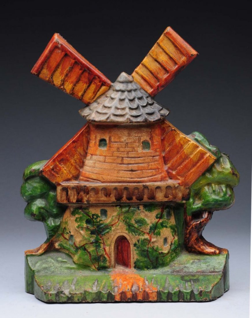 Cast Iron Windmill Doorstop.: Numbered “512”. Great detail to casting. Typical form of windmill found in Holland. Vivid paint. Condition (Excellent). Size 8 - 3/8" T.