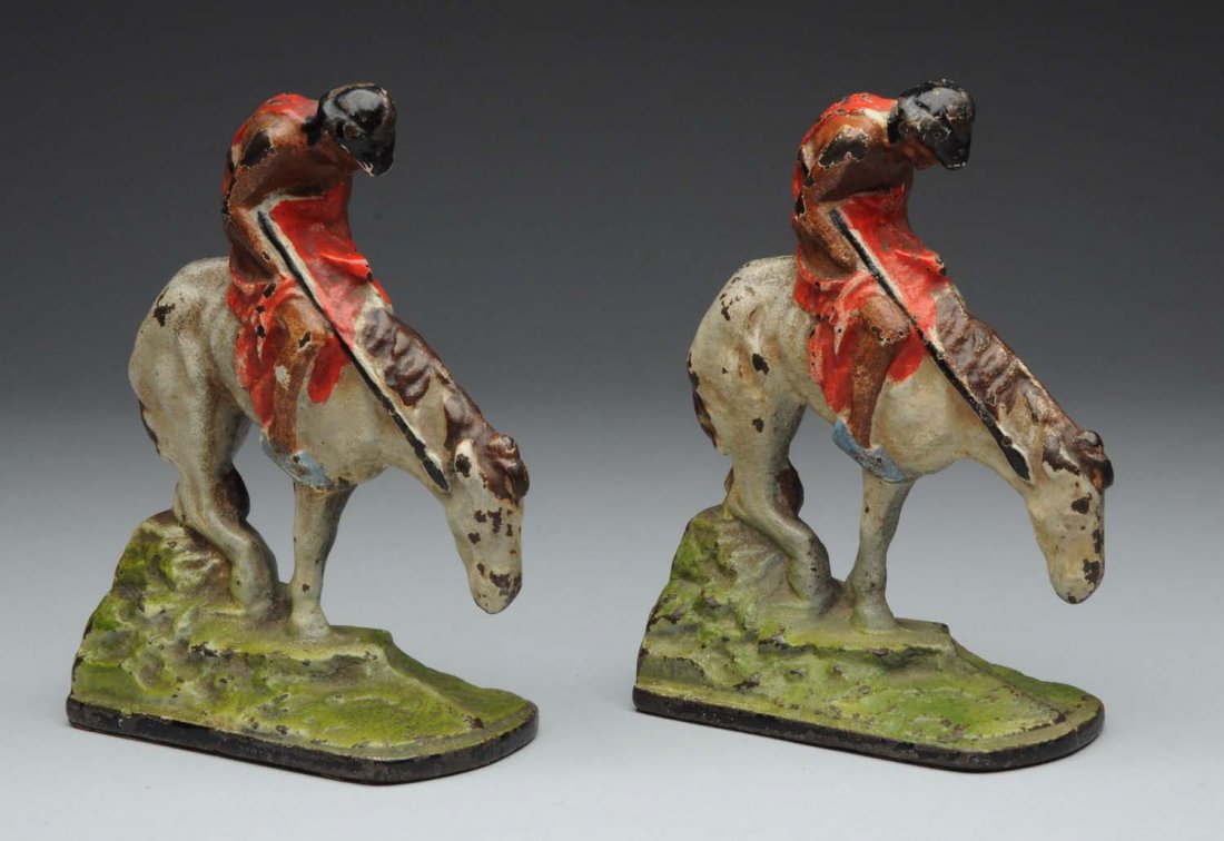 Lot Of 2: Cast Iron Indian End of Trail Bookends.: Depicts Indian holding spear on spotted horse (after long day of hunting). Full-figure, solid casting. Hubley. Condition (Excellent Plus). Size 5 -7/8" T.