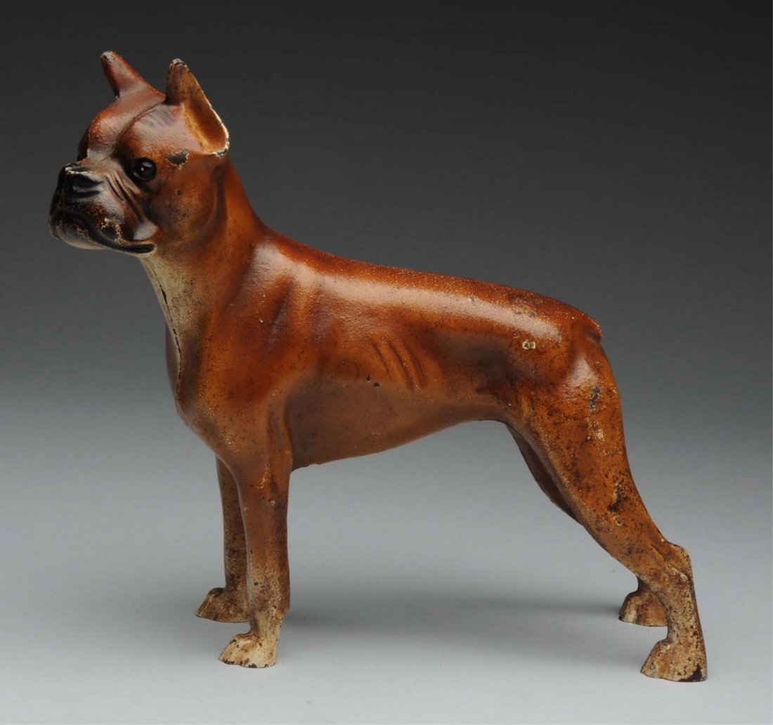 Cast Iron Boxer Dog Doorstop.: Made by Hubley. Full-figure boxer standing in show stance. Condition (Excellent). Size 8 -1/2" T.