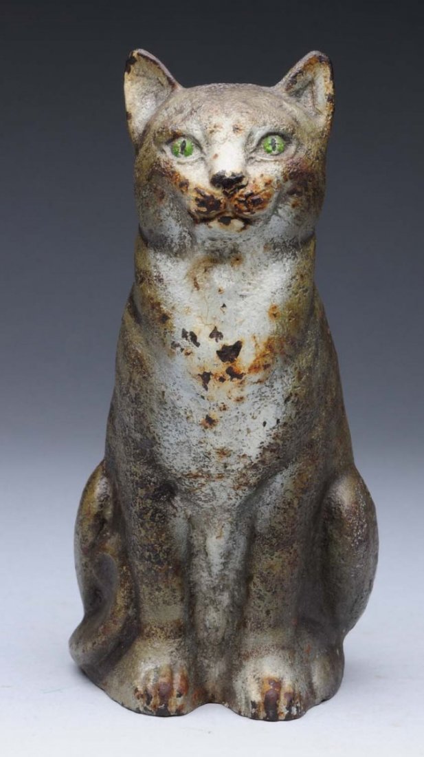 Cast Iron Sitting Cat Doorstop.: Made by Judd Company. Full-figure, solid casting tabby grey cat with flat back. Condition (Very Good - Excellent). Size 5 - 3/4" T.