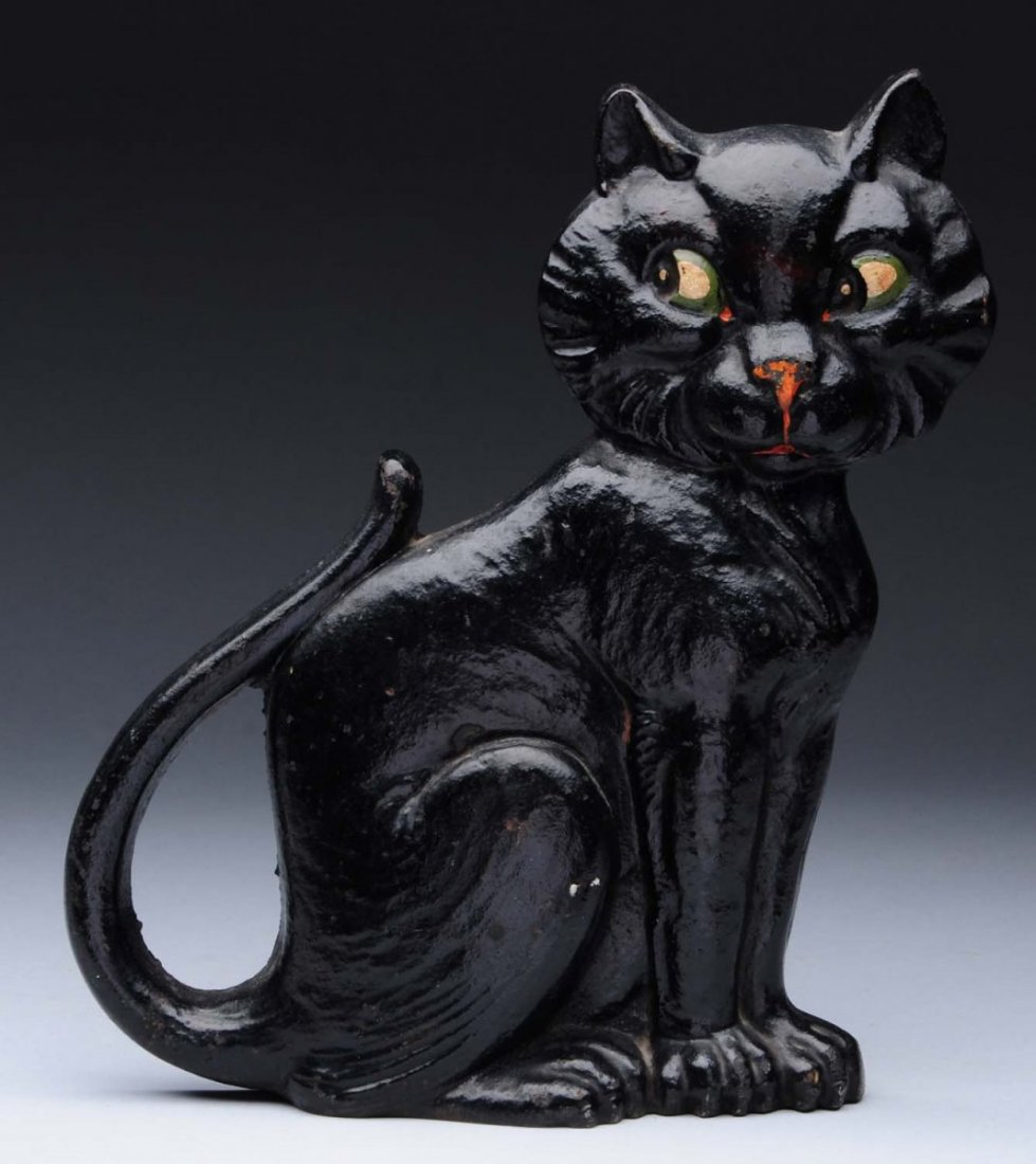 Cast Iron Sitting Cat Doorstop.: Marked, “Copyright 1927, A. M. Greenblatt Studio, 20”. Seated black cat with great expression and stance. Wonderful form. Condition (Excellent). Size 9 - 1/4" T.