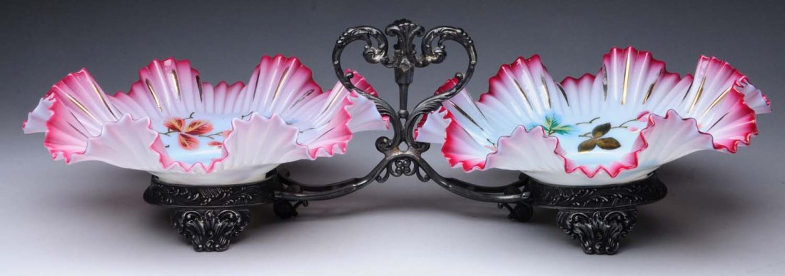 Silver Plated Bowl Stand: This lot includes a silverplate stand that holds two glass decorated bowls. Condition (Excellent). Size Largest : 16 -1/4" L.