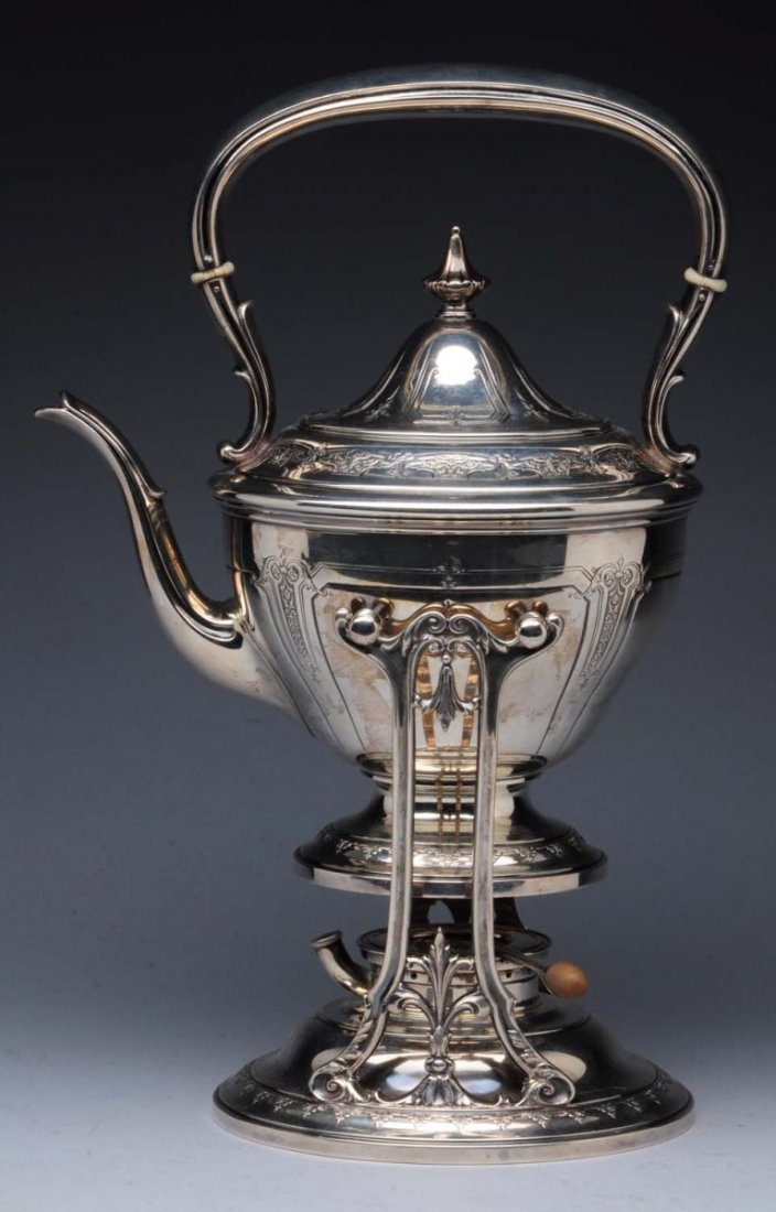 American Sterling Kettle.: Towle, with a circular body, domed lid and stand all chased with small panels of scrolls, the top with a fixed handle. Height to handle: 14 in Weight: 54.5 ozt - light signs of use and wear - light de