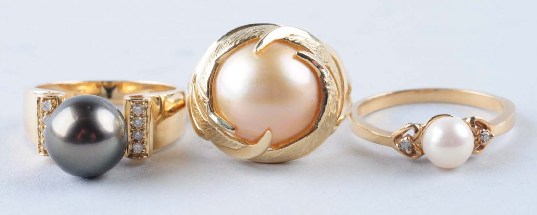 Lot Of 3: Pearl Rings.: Mabe pearl stamped 14K yellow gold classic styling, light cream color, size 7-1/4, 3.6 dwts. Tahitian pearl, 9.6mm, stamped 14K, size 7-1/2. Tahitian pearl has good luster, slight blemishes, eight acc