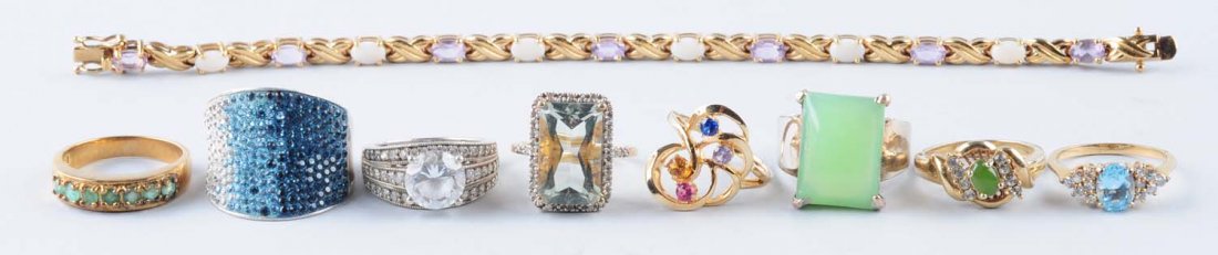 Lot Of 9: Rings & Gold Chain.: 925 green stone ring size 7. Green stone ring plated over copper. Ring with blue accent stamped 925 size 8. Imitation stone, size 7-1/4, stamped 925. Ring size 9, tested 925. Items Three are plated co