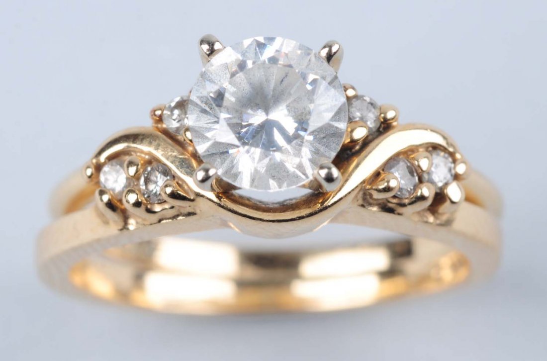 14K Yellow Gold CZ Wedding Set.: The center is cubic zirconia, size 6, 3.15 dwt. Condition (Very Good).