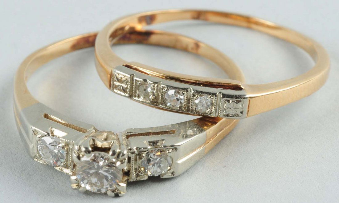 Lot Of 2: Diamond Rings.: Diamond engagement ring with three diamonds stamped 14K yellow gold. Size 8-1/4. Center diamond is approximately .20 ct, side diamonds are .07 ct each. .34 ct tdw. G-H-I color, VS2-SI2 clarity. 1.35 d