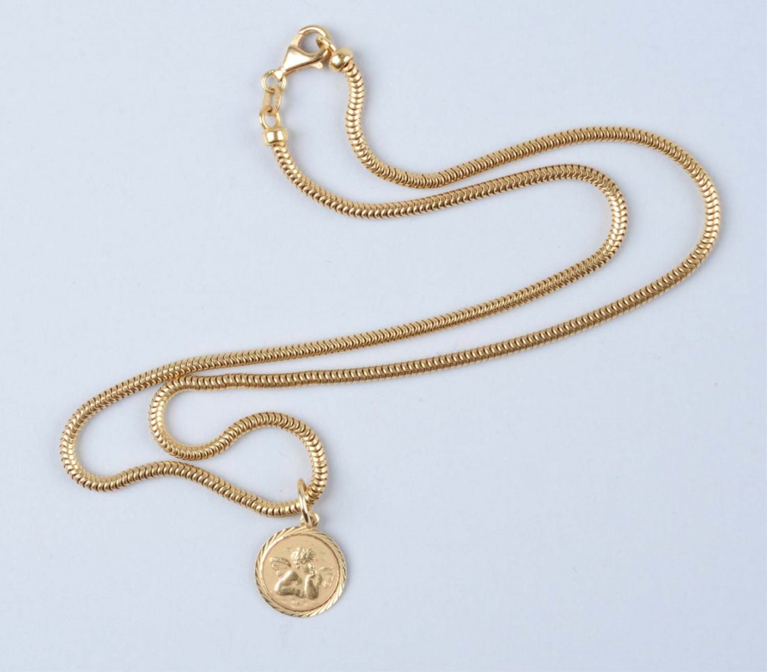 Gold Chain & Charm.: One 14K charm, .85 dwt. One 18K chain, 18", 9.8 dwt. Condition (Excellent).