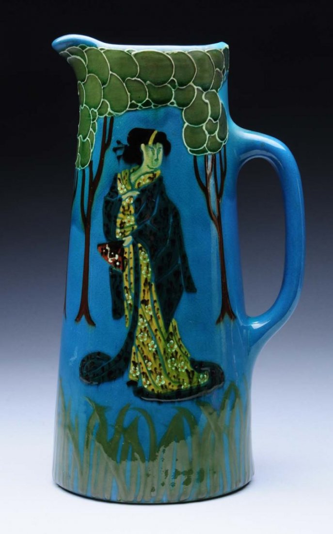 Weller Rhead Faience Tankard With Geisha.: Squeezebag decorated. Weller Rhead Faience 580. Restoration to chip at top of handle. Condition (Very Good). Size 11" x 6 - 1/2".