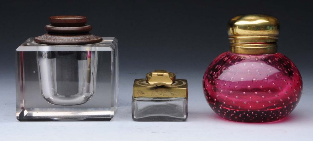Lot Of 3: Inkwells.: All with glass receptacle and brass tops. One possibly Pairpoint. One is a traveling inkwell. No damage or repairs. Condition (Excellent). Size Largest : 3 -1/4" T.