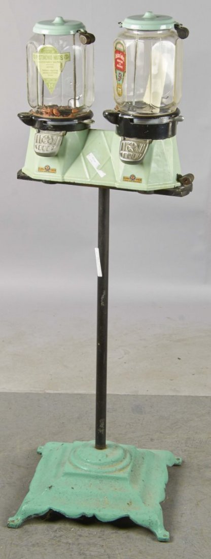 Columbus Bi-More Vending Machine On Stand: This double light green porcelain bulk vending machine on cast iron stand looks to be the Model 39 with a new stand. One machine's label states; Pistachio Nuts Columbus Model ZM 1 and the other machin