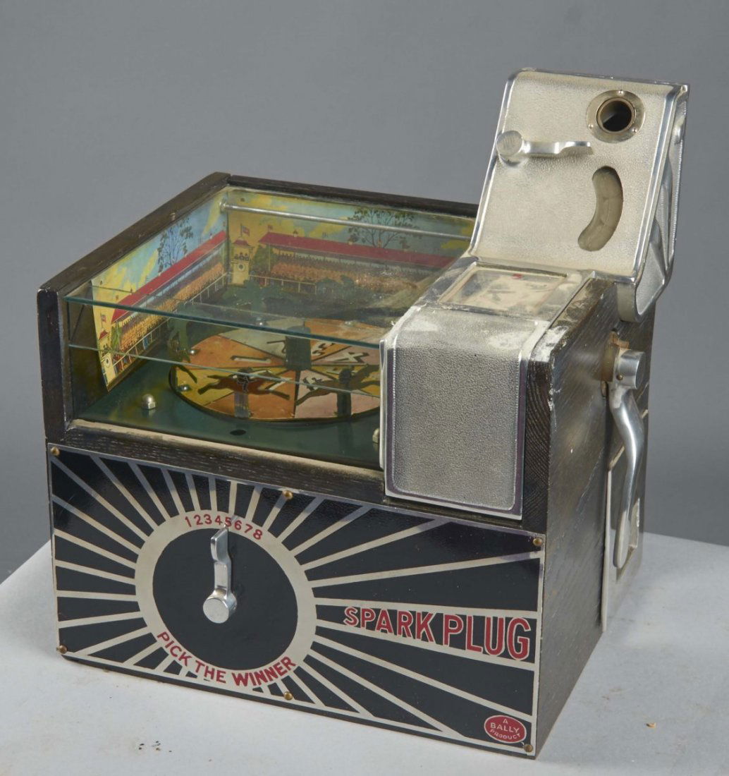 5 ¢ Bally Spark Plug Horse Race Slot Machine: This countertop wheel horse race gambling game slot machine resembles a trade stimulator, but is full payout. Includes key. Condition (Excellent). Size 13-1/2" x 12" x 16"