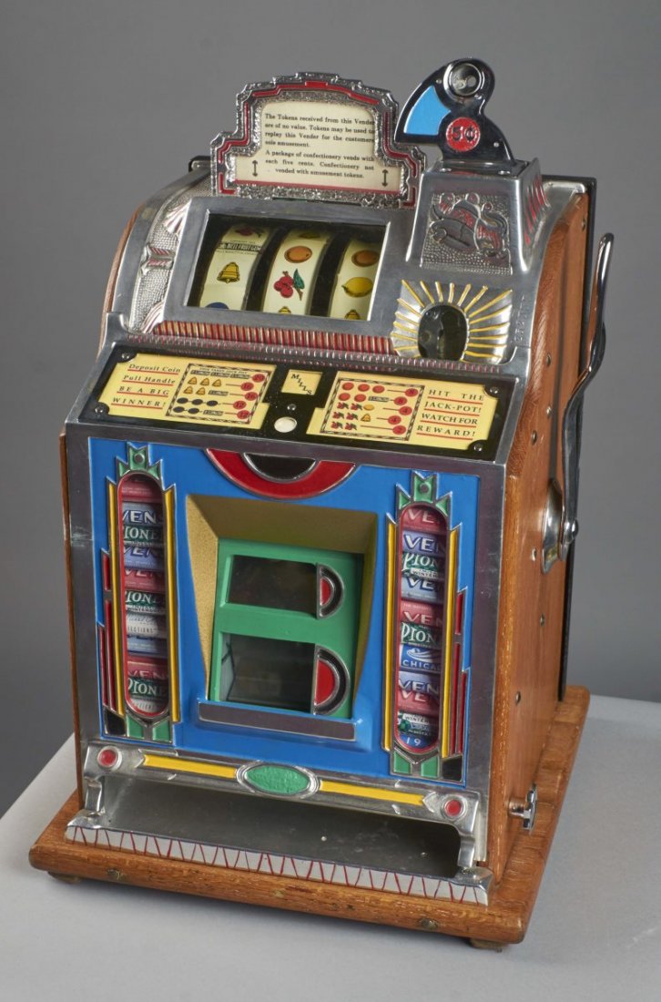 5 ¢ Mills F.O.K. Slot Machine: 5 cent Mills Novelty Jackpot Front Vendor gooseneck bell slot machine with top sign marquee. Circa 1930. Slot has a conversion Mills two-column front with full size jackpot. Back door is new. Missing