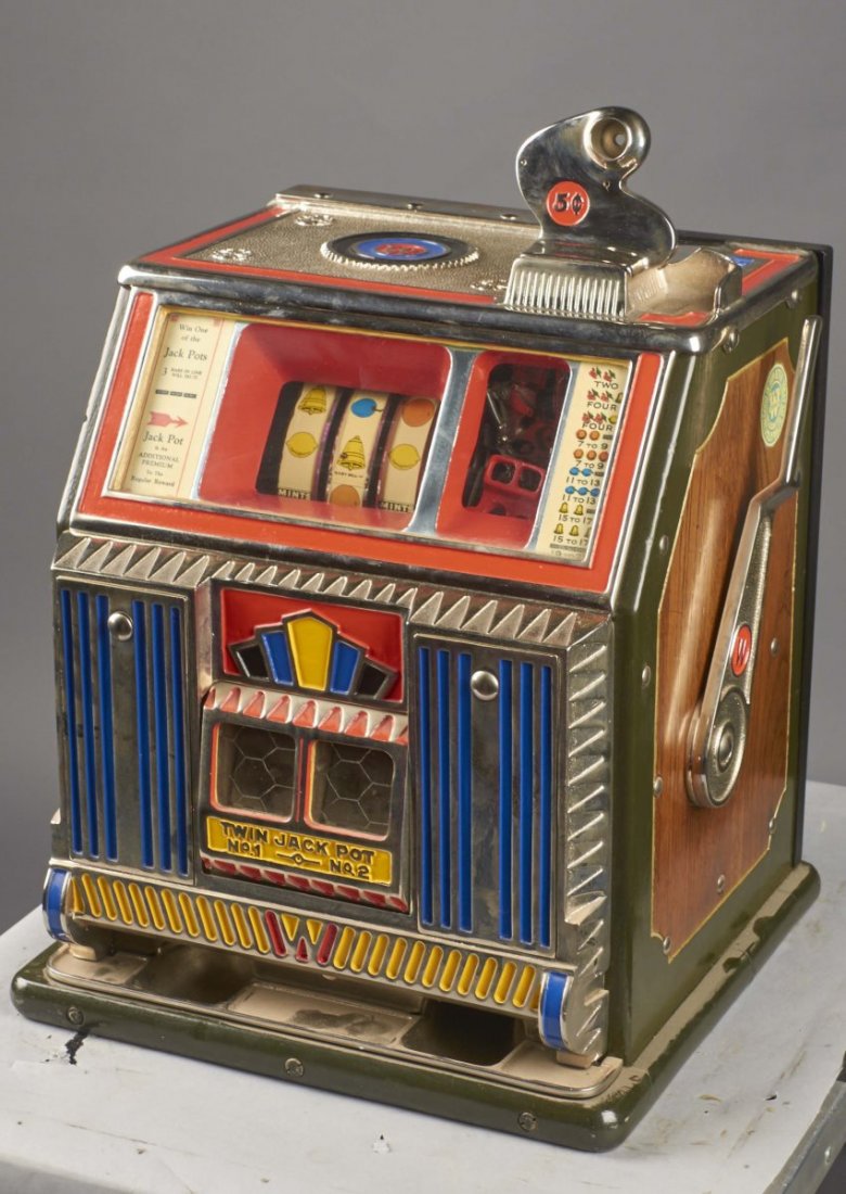 5 ¢ Watling Baby Bell Twin Jackpot Slot Machine: 5 cent Watling Baby Twin Jackpot gooseneck bell slot machine. Circa 1933. Vendor roller and trip are missing. Back door and cash box are new. Includes keys. Condition (Restored). Size 15" x 15" x 22"