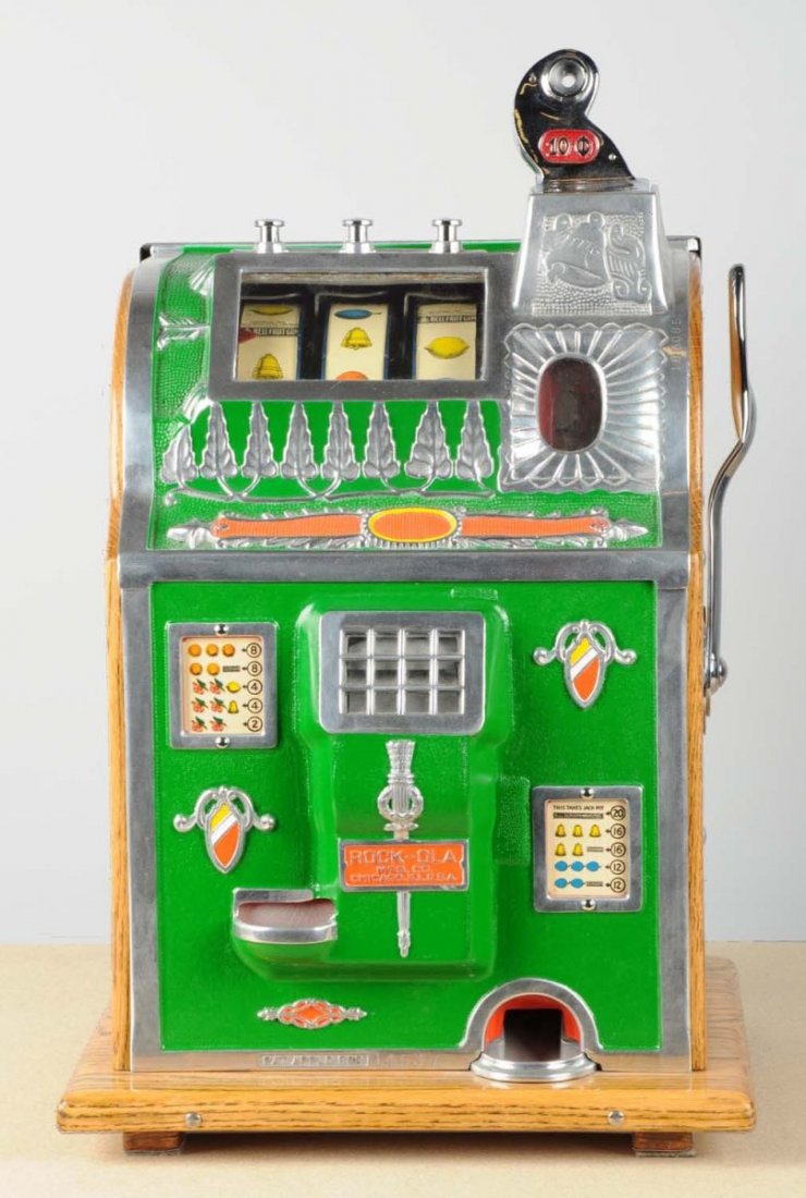 10 ¢ Mills/Rock Ola Slot Machine: This is a Mills machine with a Rock Ola conversion front. Slot machine very similar to the revamp gooseneck bell Mills Jackpot New Model or the Rockola Reserve. Has skill stops. Includes keys. Conditi