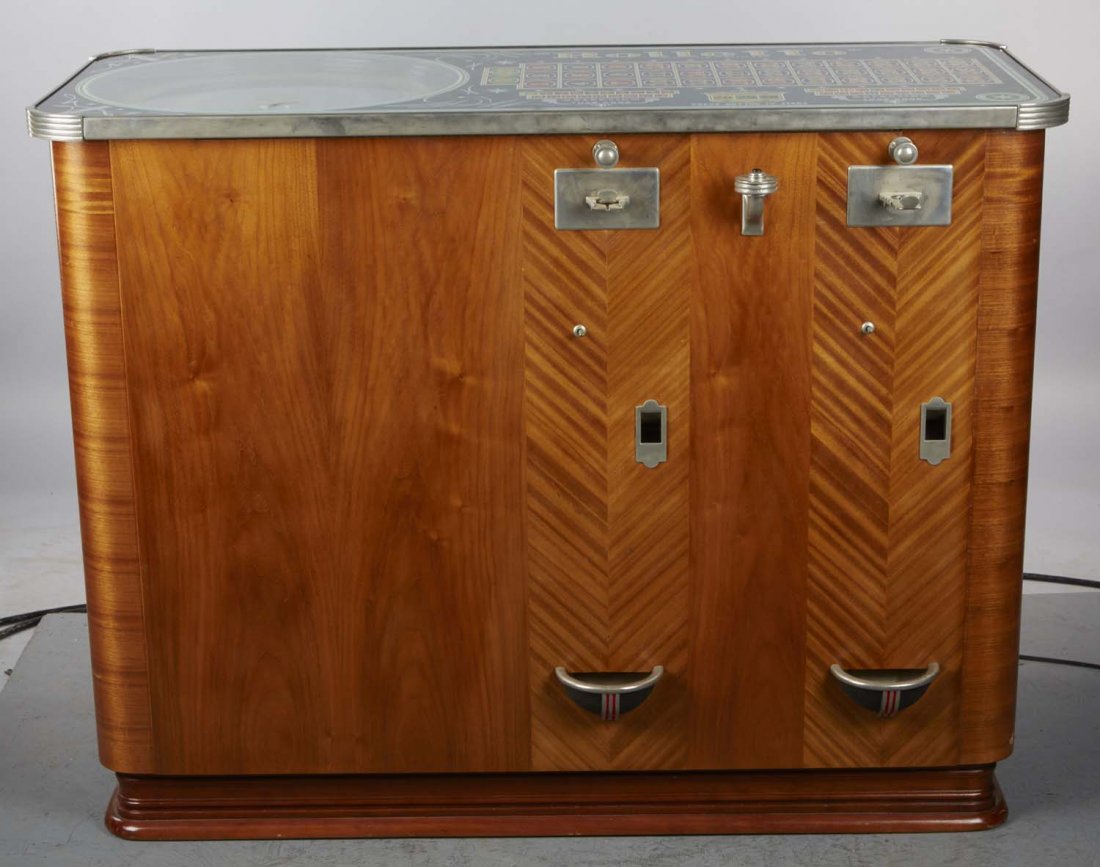 5 ¢ H.C. Evans Rolleto Console Slot Machine: 5 ¢ H.C. Evans Rolleto console roulette wheel double slot machine. Plays, but some lights not working. Will need contacts cleaned. Circa 1938. Condition (Excellent). Size 39" x 22" x 50" CORRECTION: 