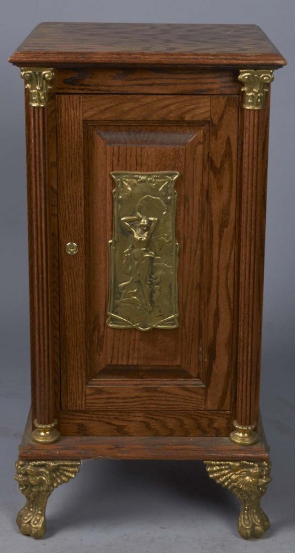 Slot Machine Stand With Metal Feet: Stand has front nude woman casting, column detail, and brass trim with locking door. Condition (Good). Size 34" T.