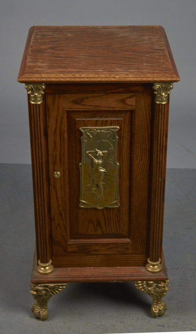 Slot Machine Stand With Metal Feet: Stand features front nude woman casting and 2 columns. Has brass/bronze colored trim and locking door with 1 shelf inside. Includes keys. Condition (Good). Size 18" x 18" x 33-1/2"