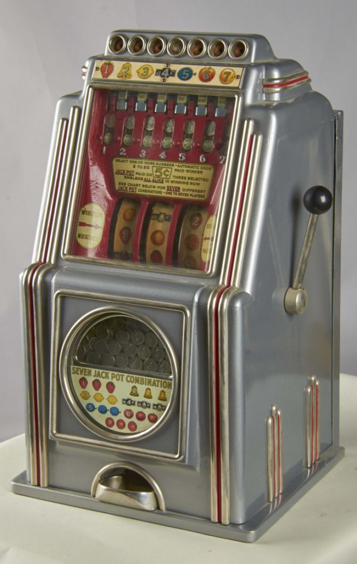 5¢ A.C. Novelty Multi-Bell Seven Way Slot Machine: 5 cent A.C. Novelty Company Multi-Bell "Seven Way" 3-reel 7-way club bell slot machine. Circa 1936. Includes key. Condition (Restored). Size 15" x 14" x 26"